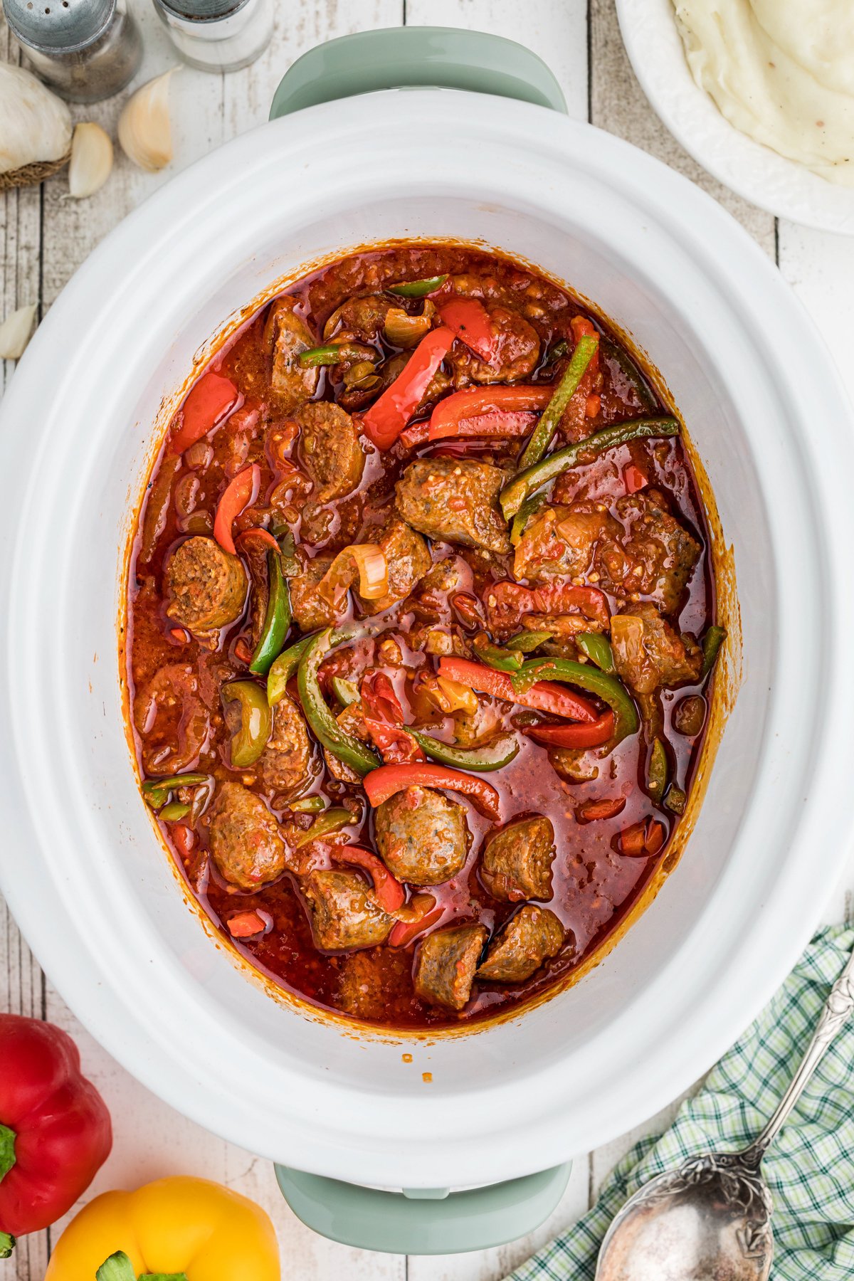 Cooked sausage and peppers in a marinara sauce.