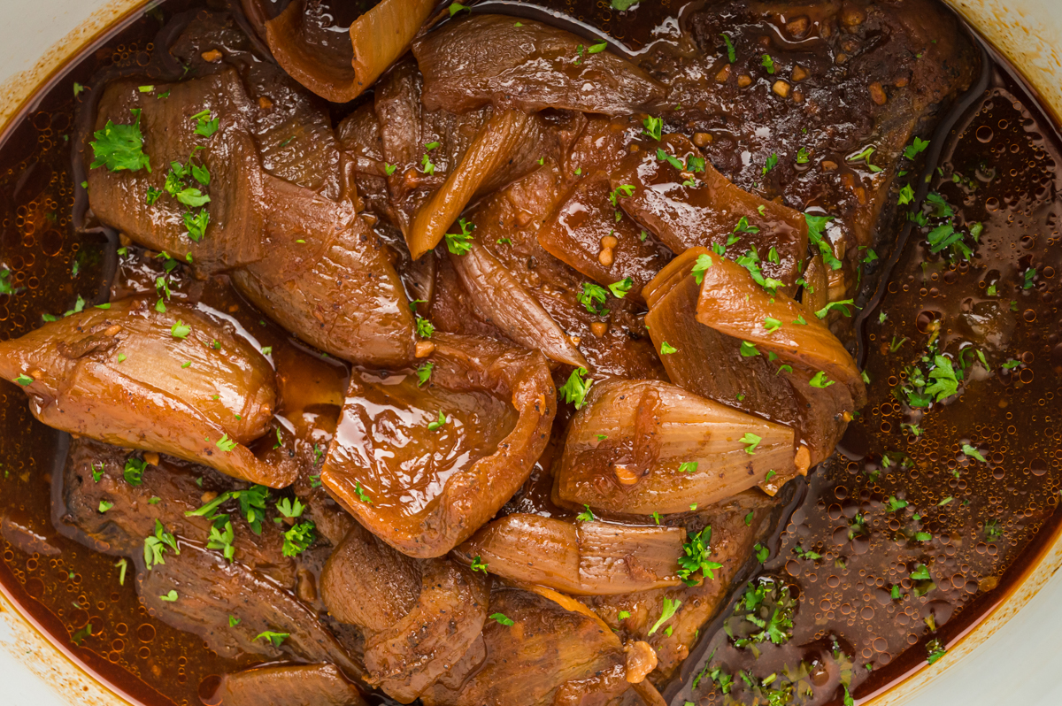 close up of beef brisket in a slow cooker.