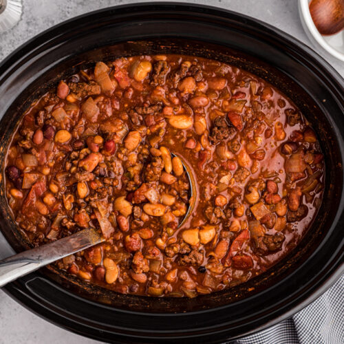 overhead shot of 15 bean chili with a spoon in it.