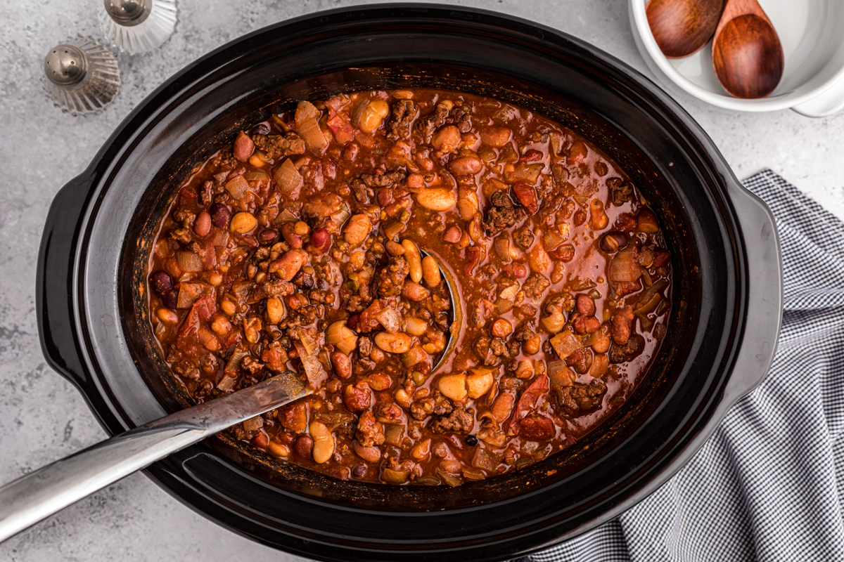 overhead shot of 15 bean chili with a spoon in it.