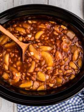 Apple pie filling and baked beans in a crockpot.