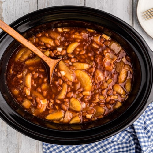 Apple pie filling and baked beans in a crockpot.