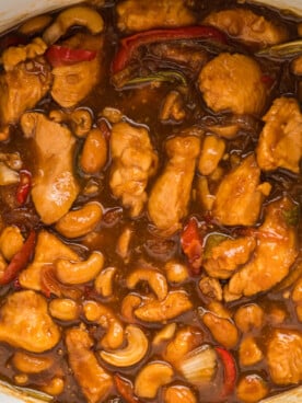 close up of cashew chicken, done cooking in a slow cooker.