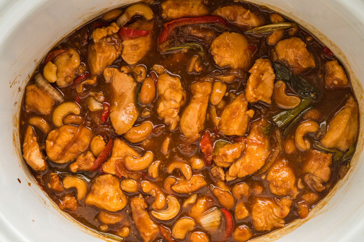 close up of cashew chicken, done cooking in a slow cooker.