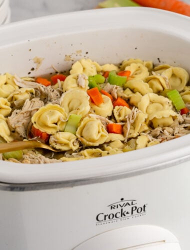 Chicken tortellni soup in a crockpot.