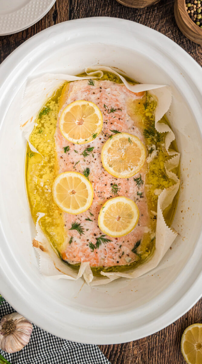 long image of salmon in a slow cooker.