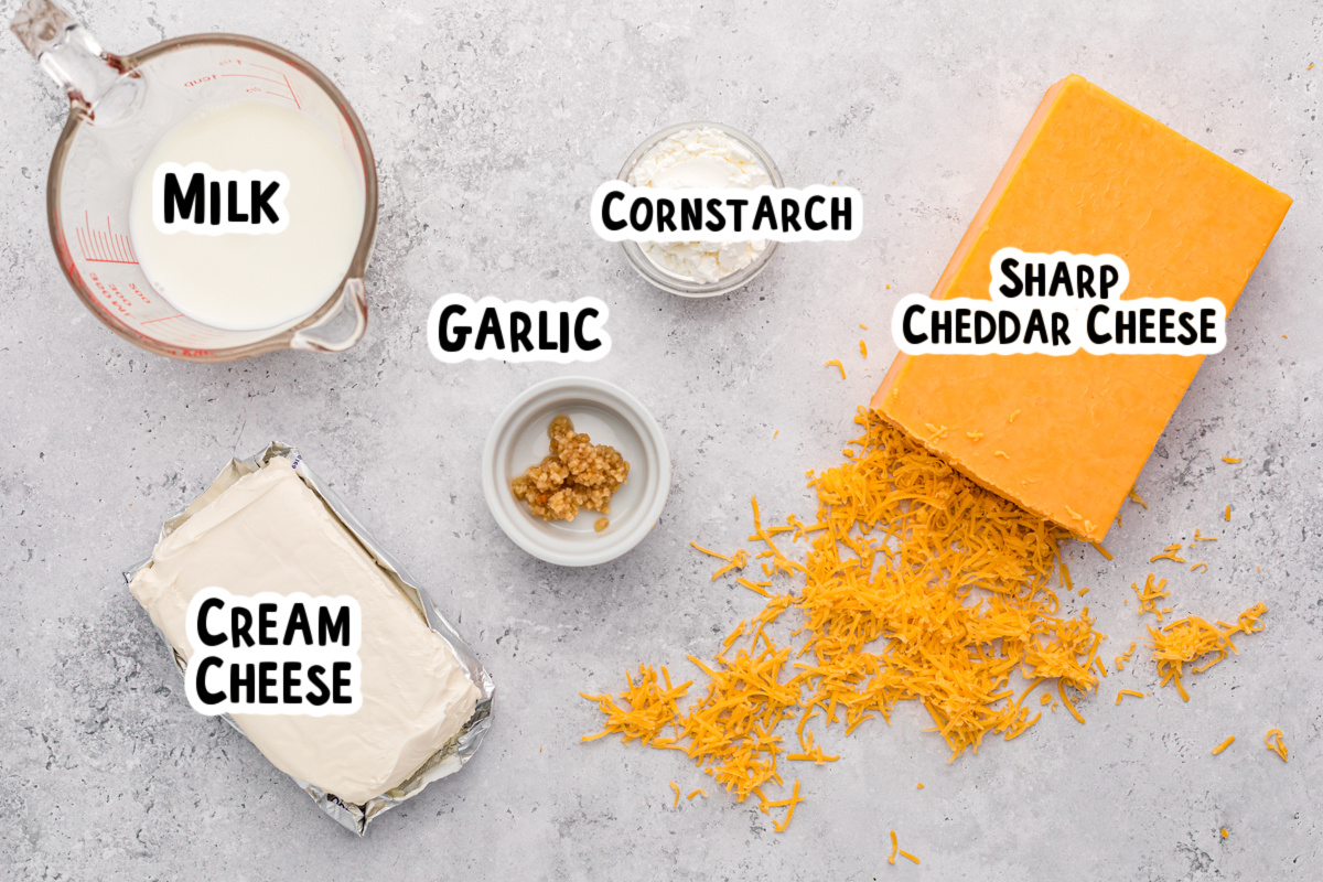 ingredients for cheese fondue on a table.