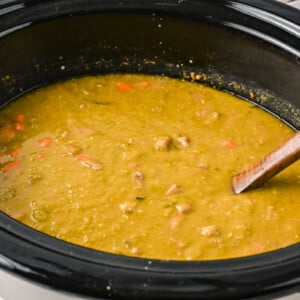 side view of split pea soup in a crockpot, done cooking.