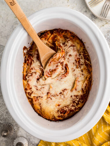 Cooked stuffed shells in a slow cooker.