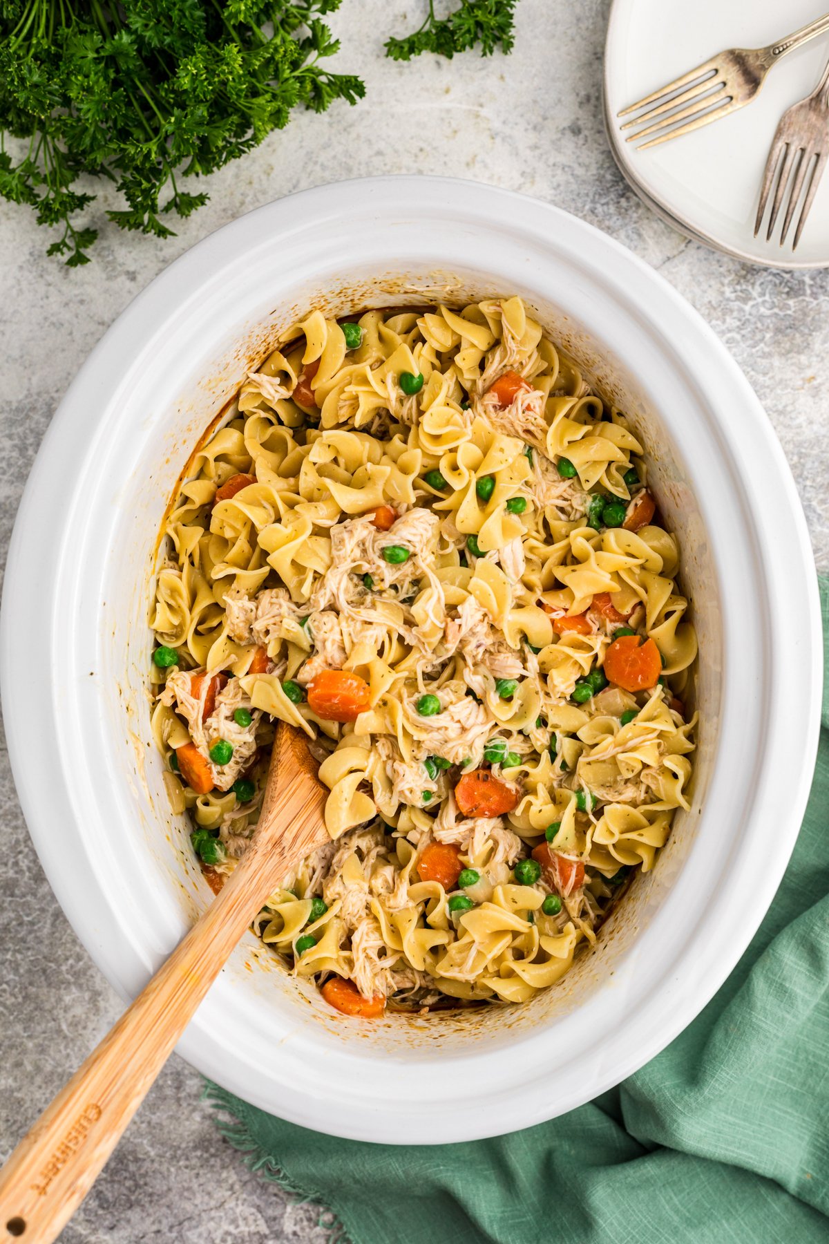 chicken and noodles done cooking in a slow cooker.