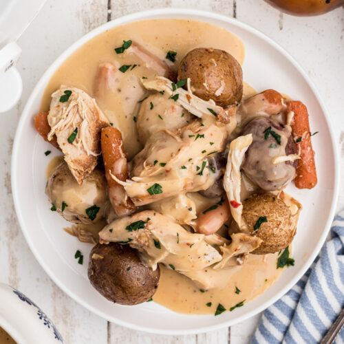 plate of chicken, potatoes and gravy.