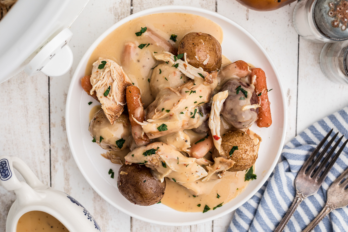 plate of chicken, potatoes and gravy.