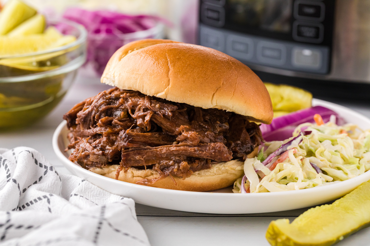 Barbecue beef on a hamburger bun.