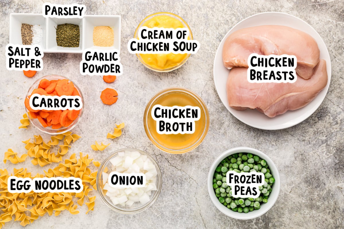 Ingredients for chicken and noodles on a table.