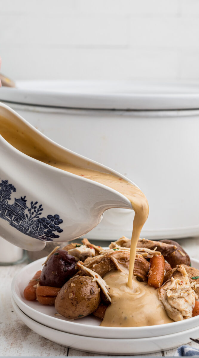 long image of italian chicken with gravy being poured over.