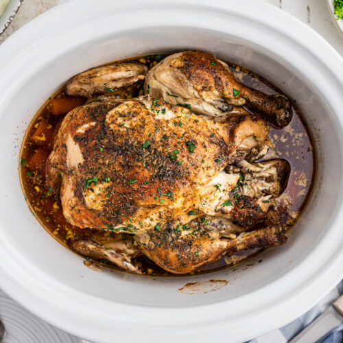 whole chicken in a slow cooker, done cooking.