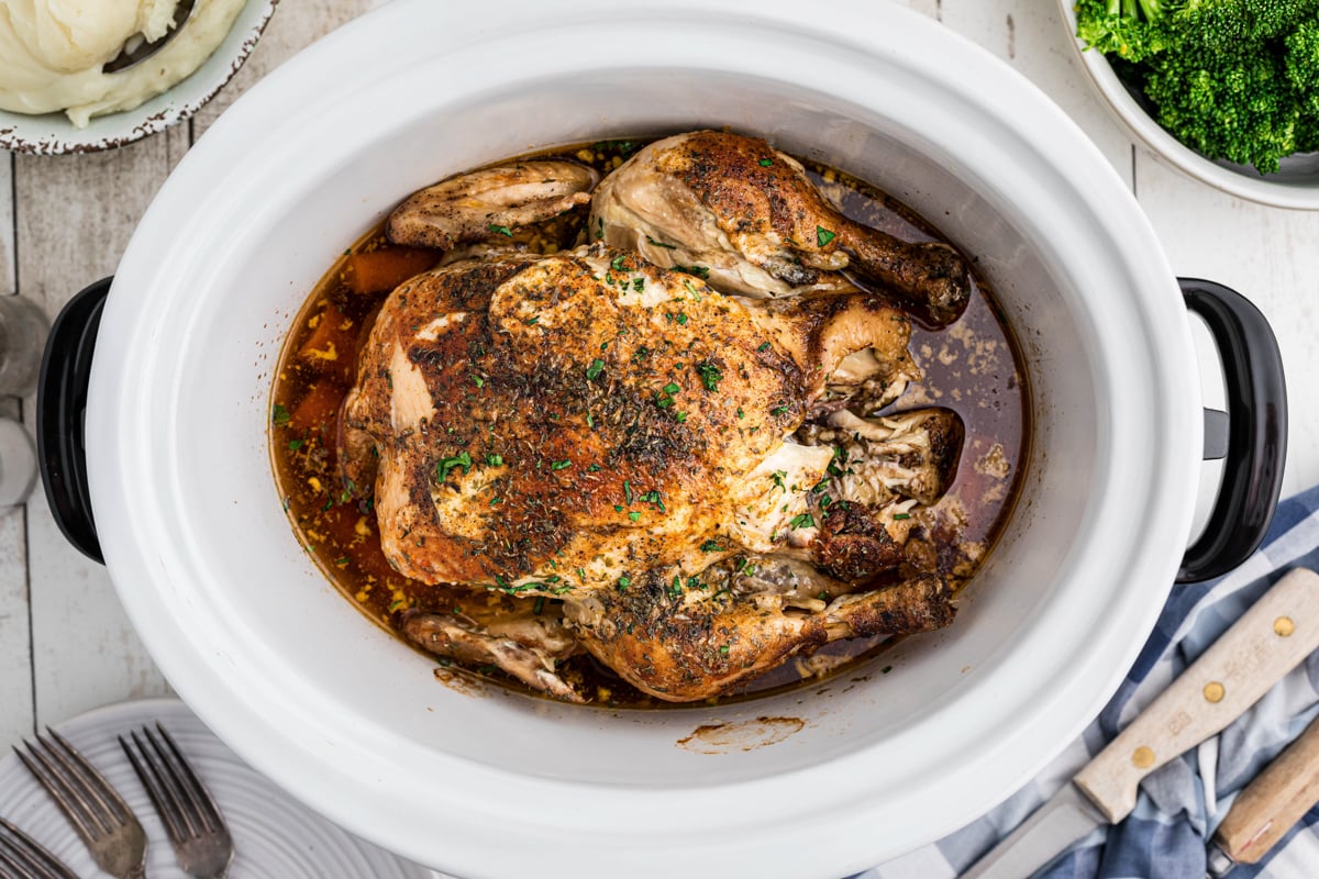 whole chicken in a slow cooker, done cooking.