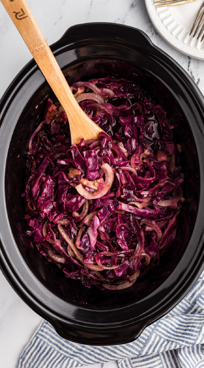 long image of red cabbage in a slow cooker.