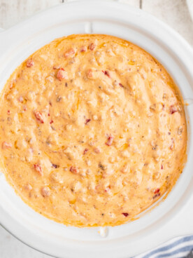 overhead shot of warm pimento dip in a slow cooker.