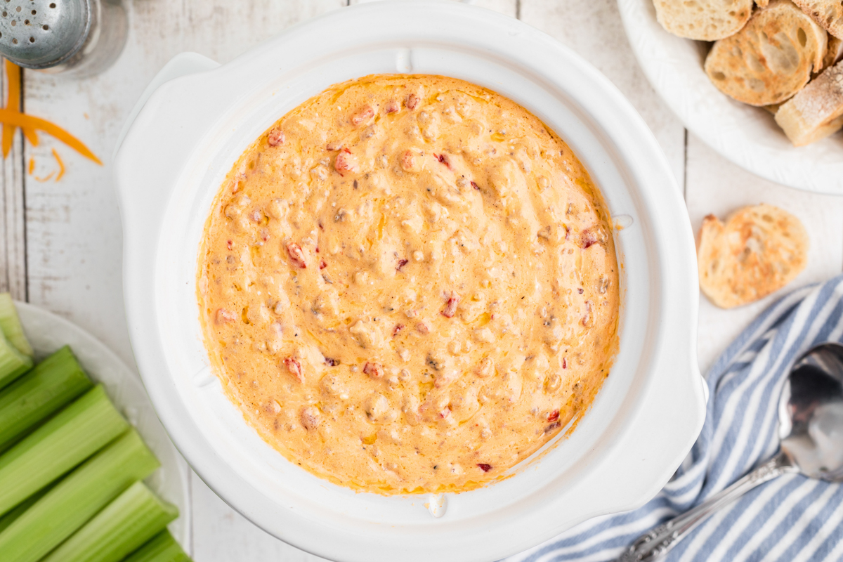 overhead shot of warm pimento dip in a slow cooker.