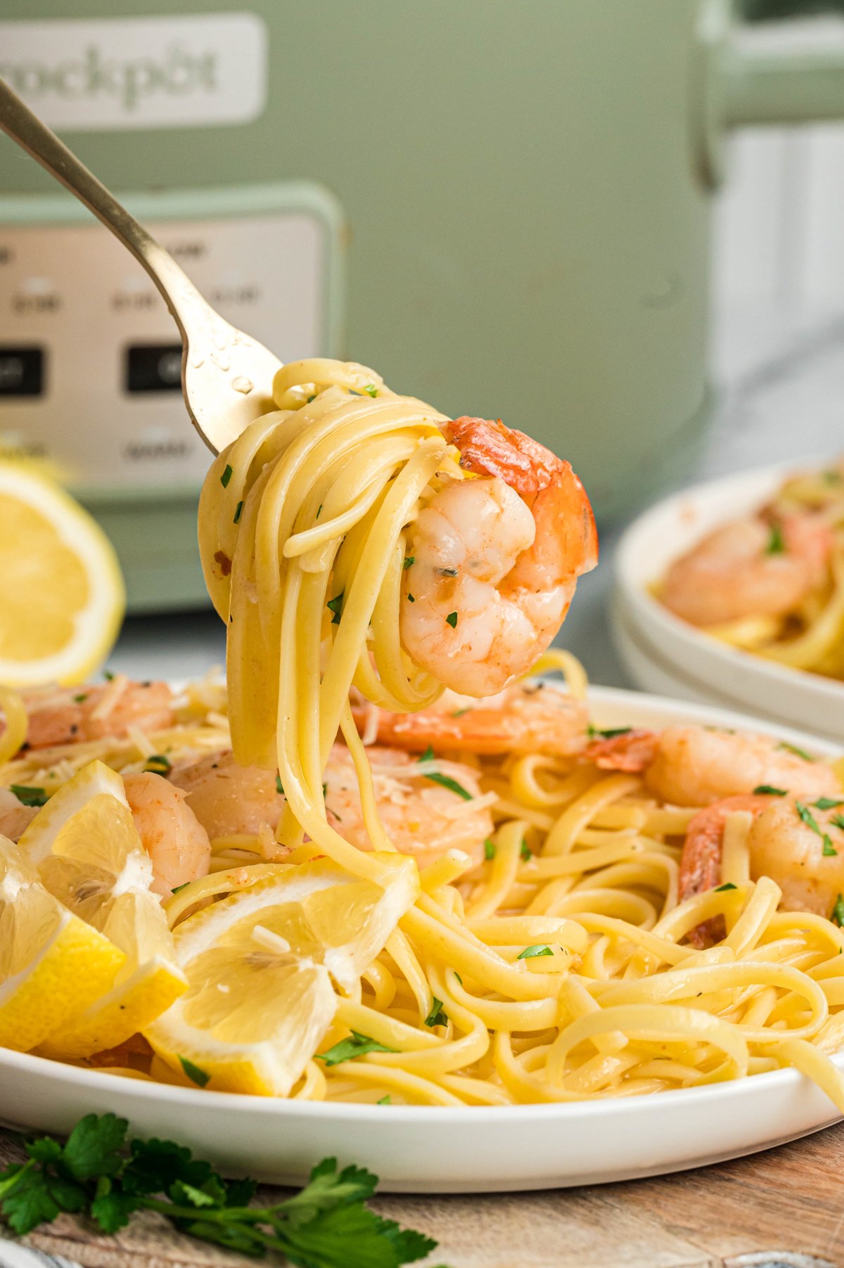 shrimp scampi on a fork.