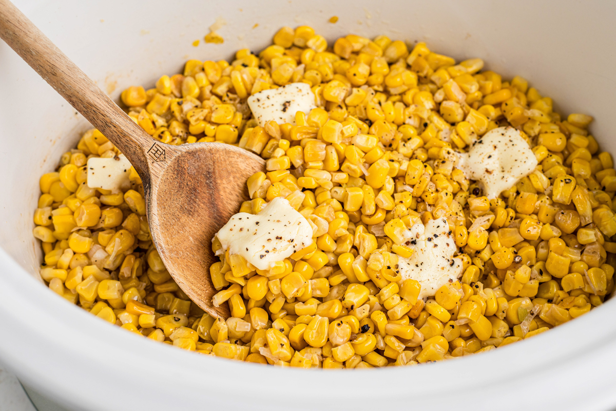 close up of fried corn in a slow cooker.