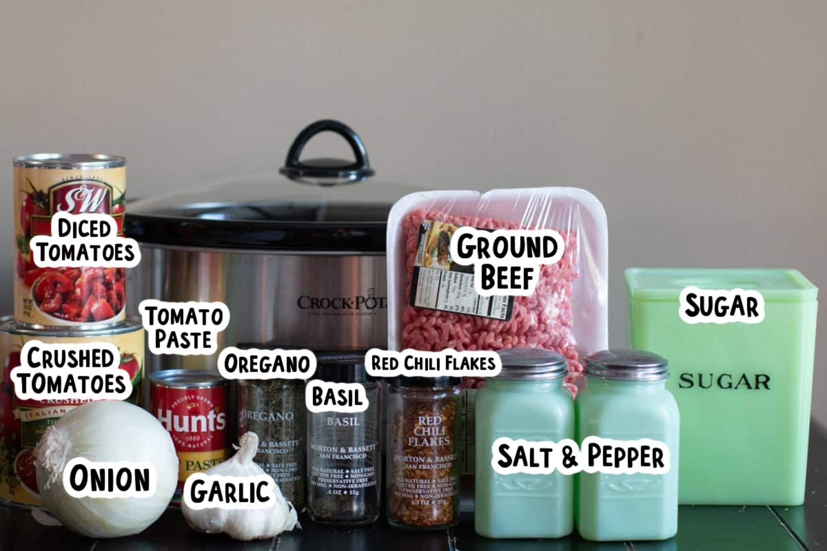 Ingredients for spaghetti sauce in front of a slow cooker.