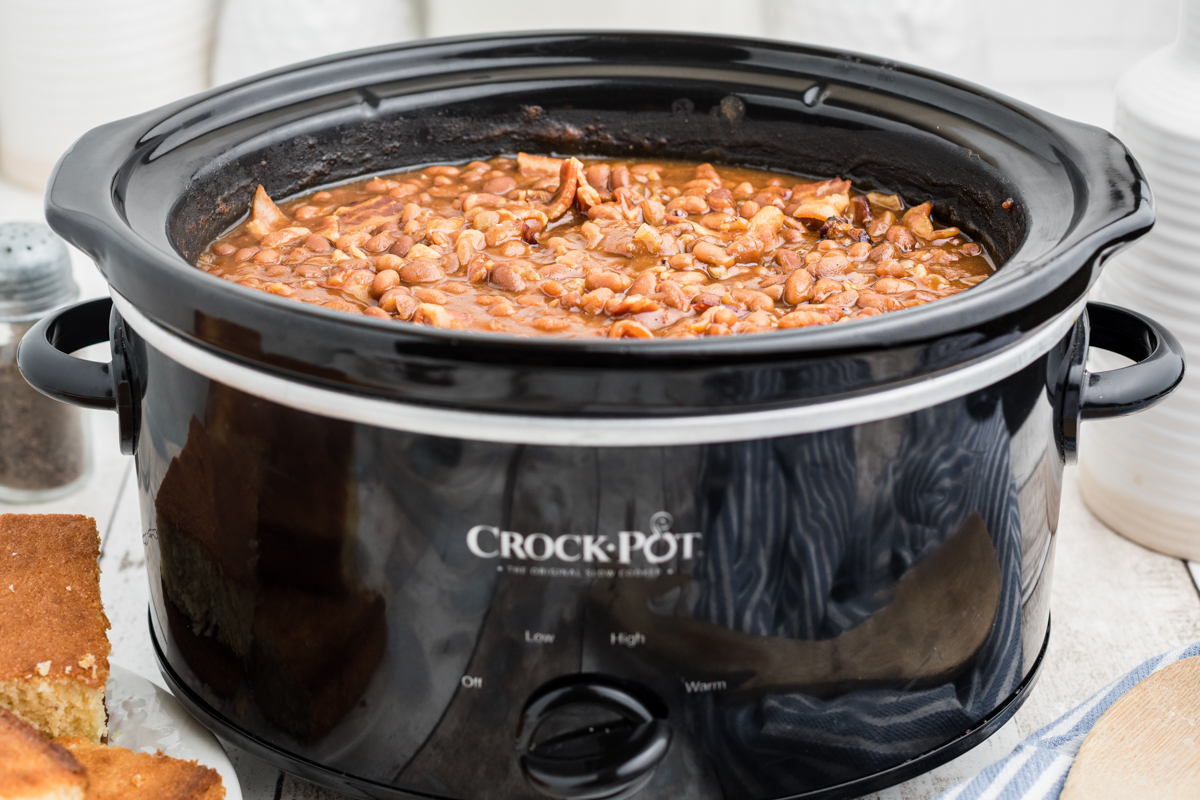 Side view of baked beans in a crockpot.