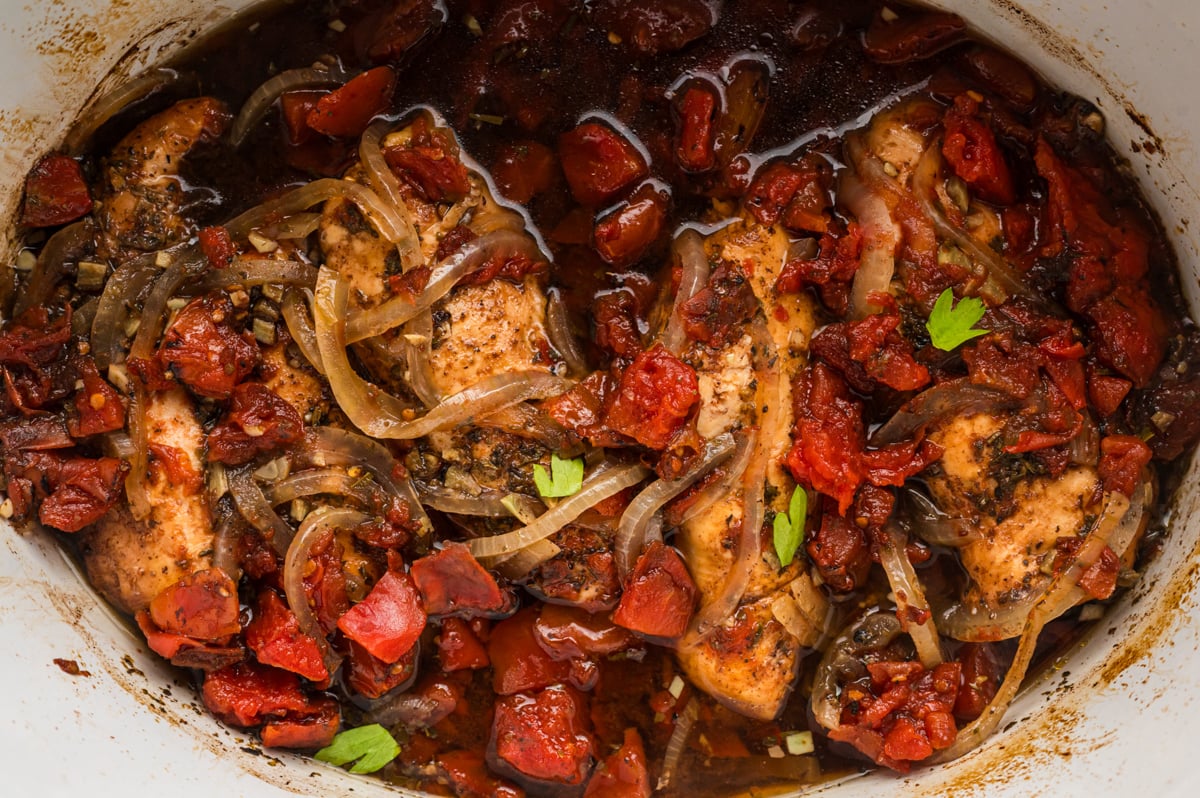 overhead shot of balsamic chicken in slow cooker.