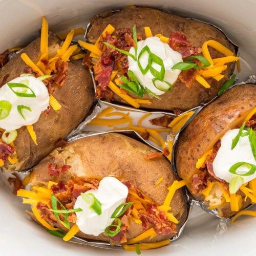 close up of baked potatoes in a crockpot.