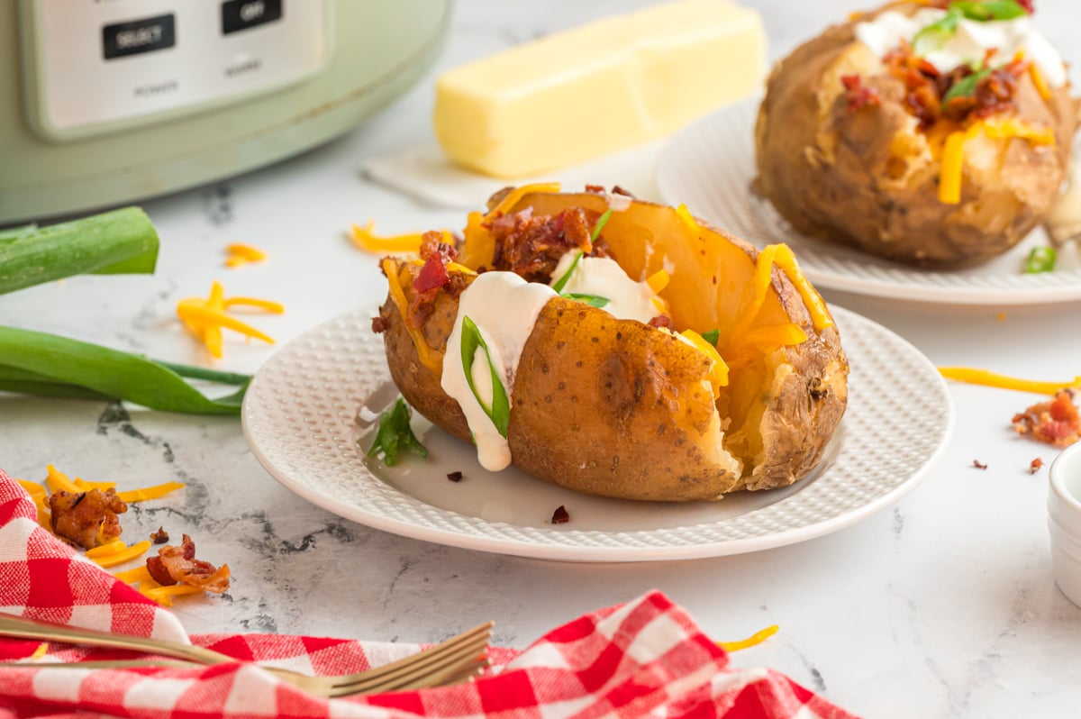 plate of baked potatoes in a slow cooker.