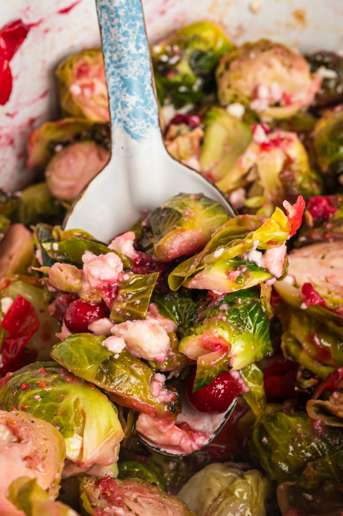 Close up of brussels sprouts on a spoon.