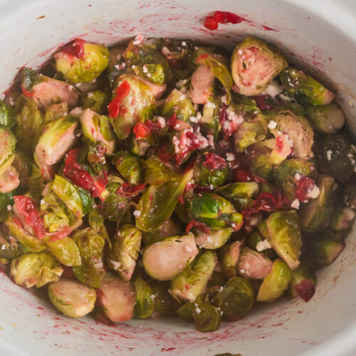 Overhead shot of brussel sprouts in a slow cooker.