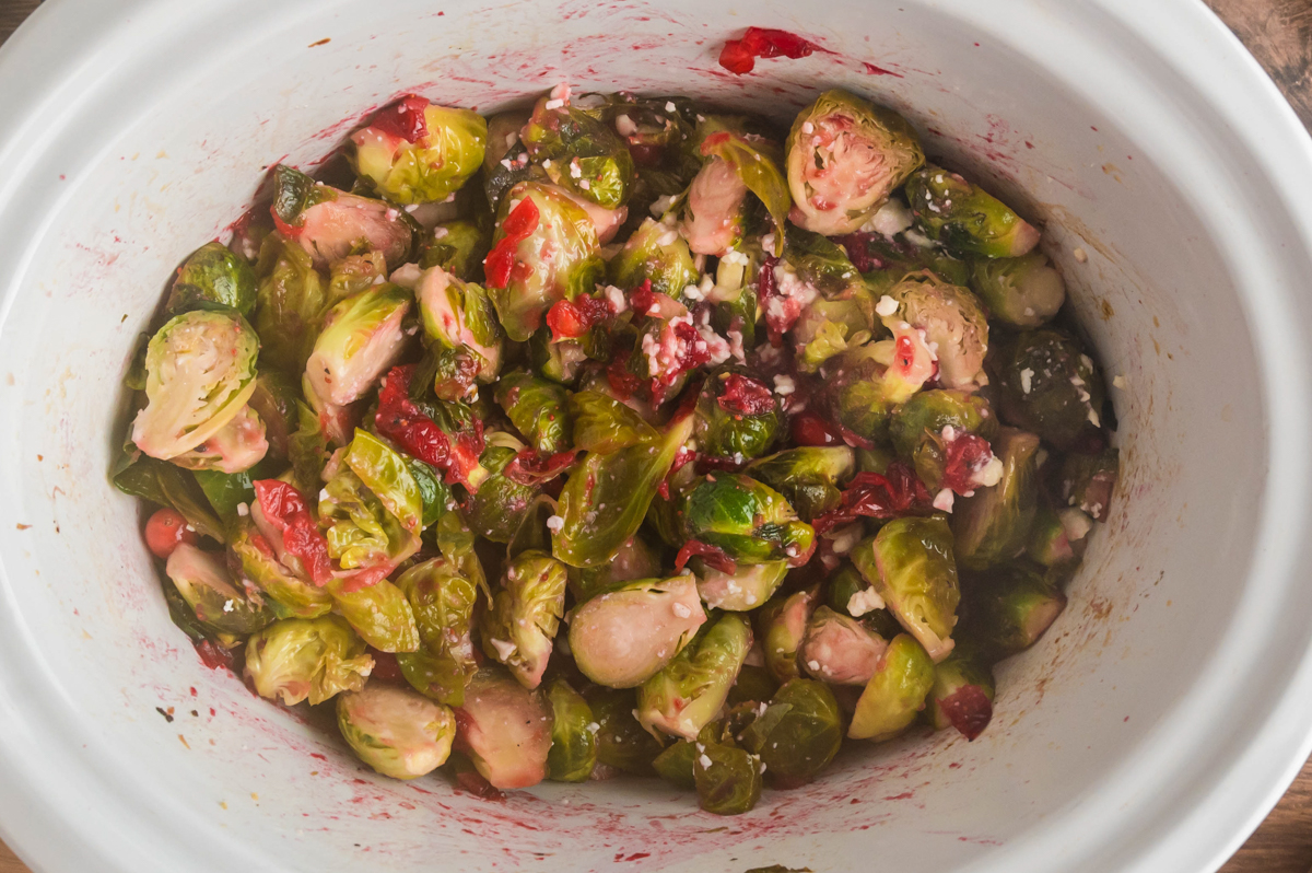 Overhead shot of brussels sprouts in a slow cooker. 