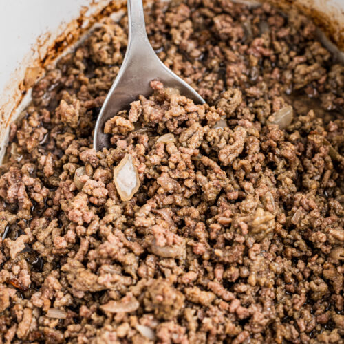 Cooked ground beef in a crockpot.