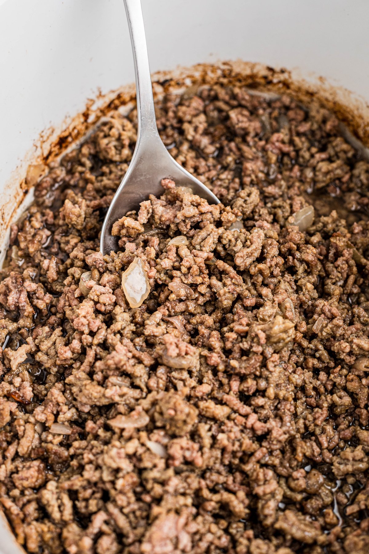 Cooked ground beef in a crockpot.