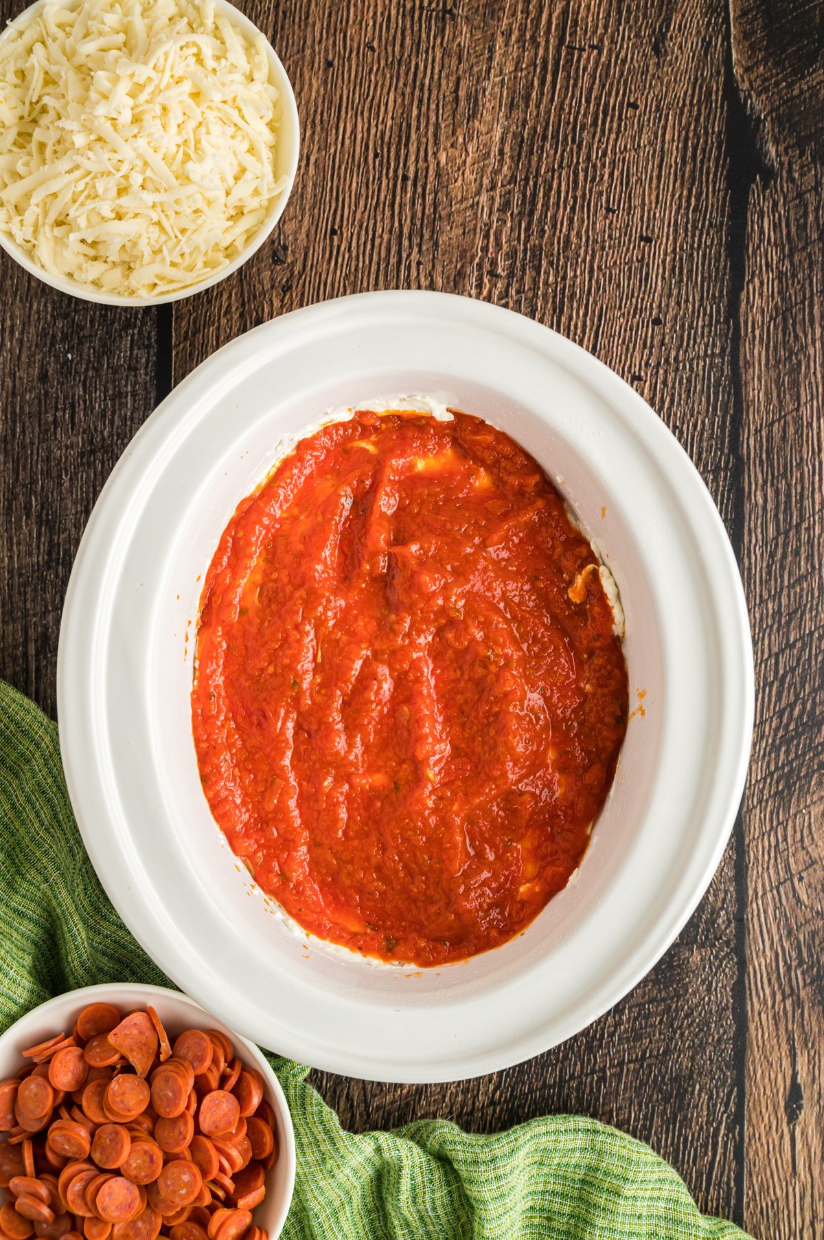 pizza sauce on top of ricotta mixture.