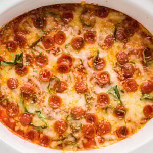 overhead shot of pizza dip in a white slow cooker.