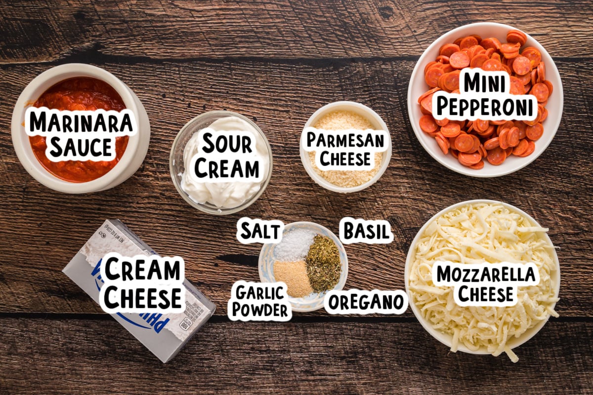Ingredients for pizza dip on a table.