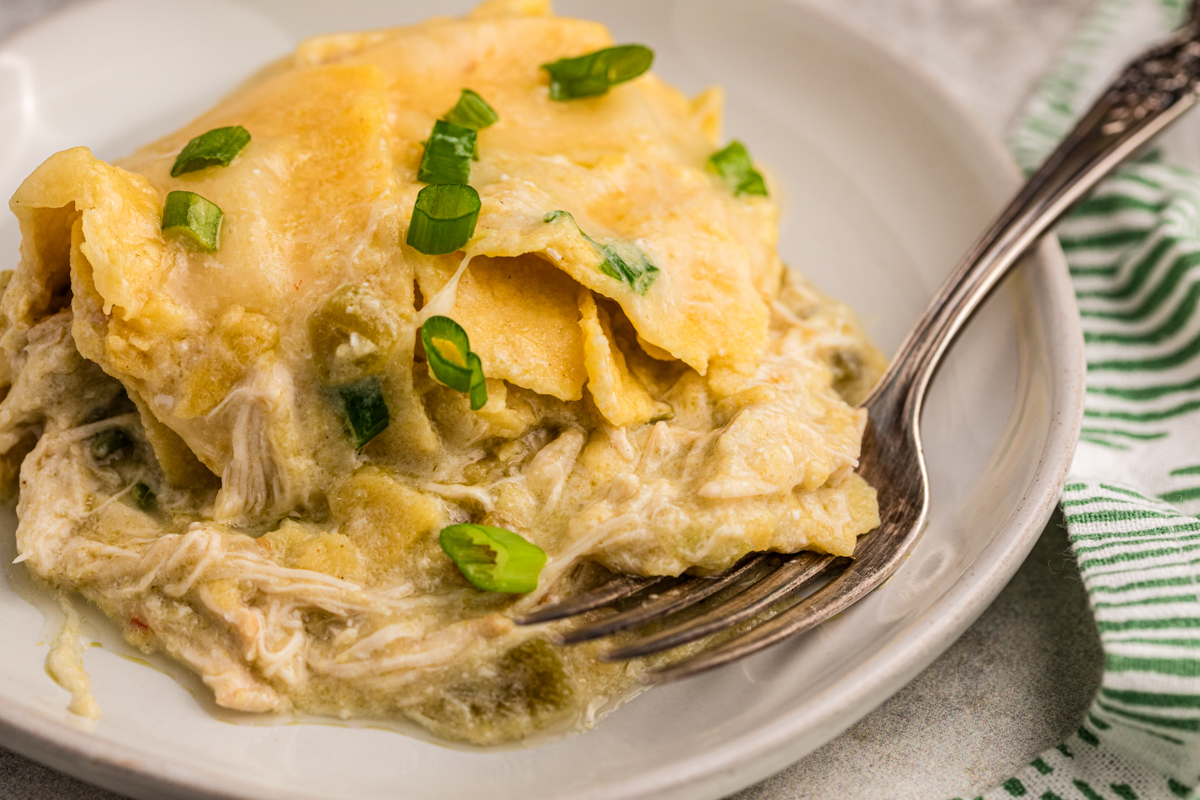 Plate of green sour cream enchilada casserole.