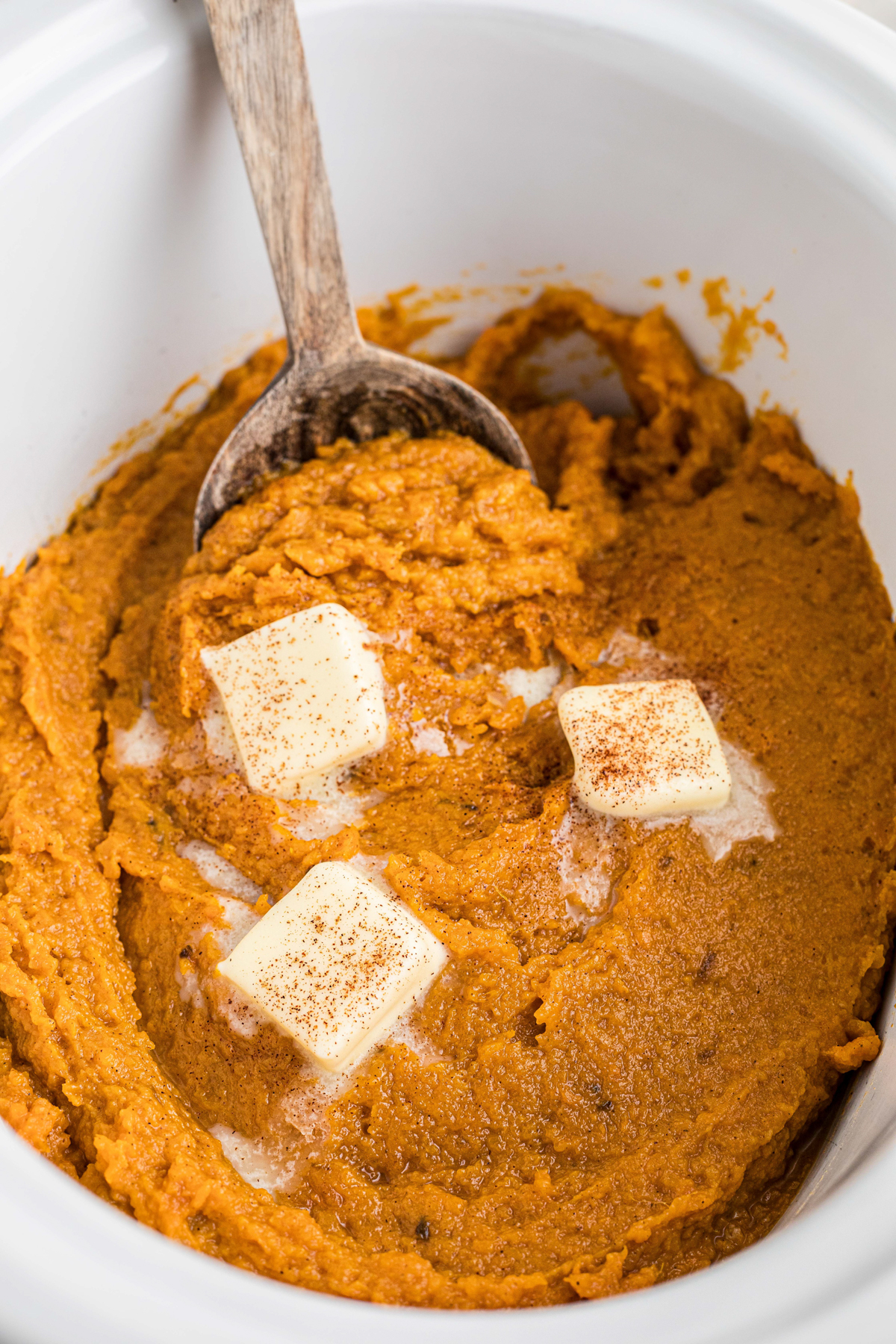 close up of mashed sweet potatoes in a crockpot.
