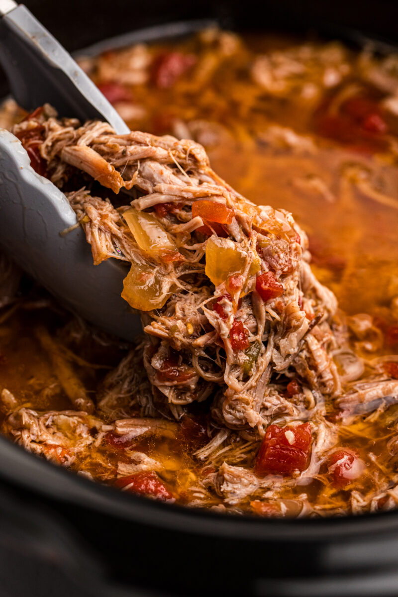 Close up of pork burrito filling in a slow cooker.