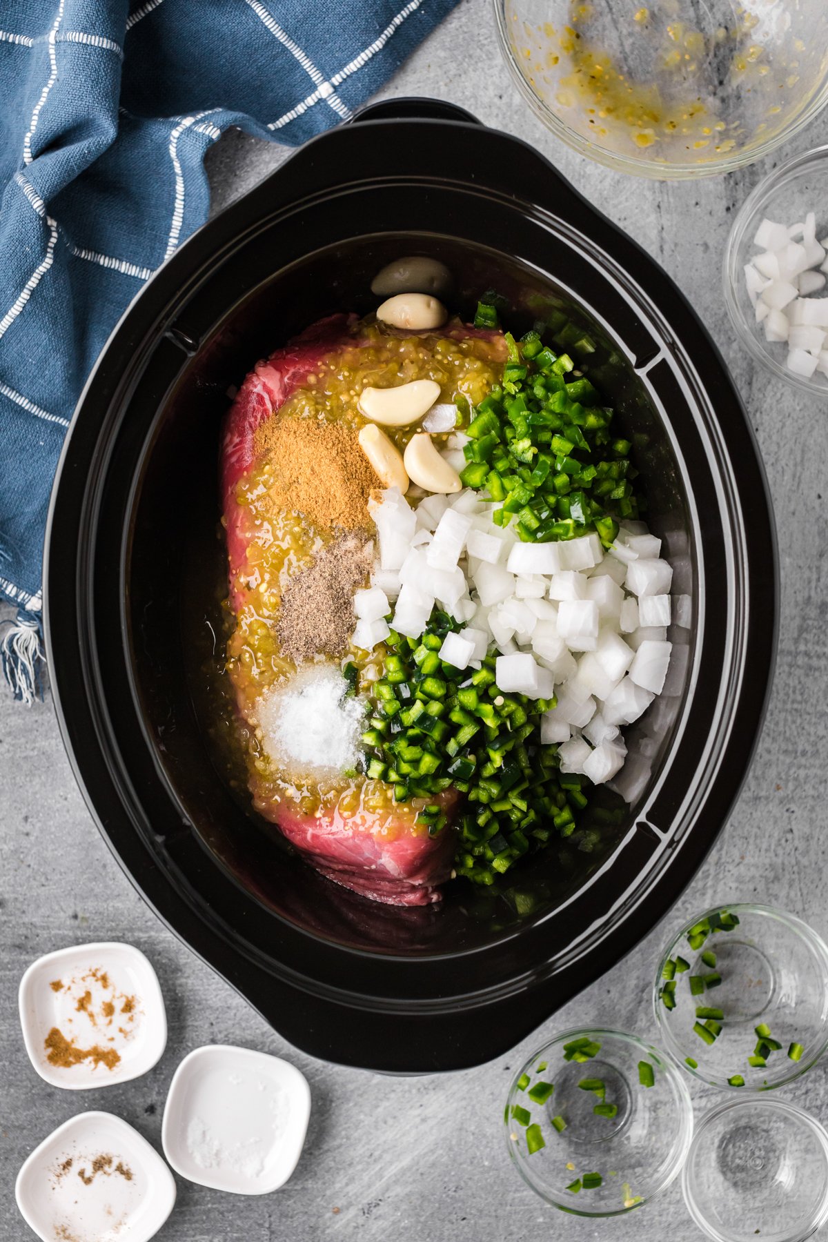 chuck roast with green salsa, onions and chiles and seasonings.