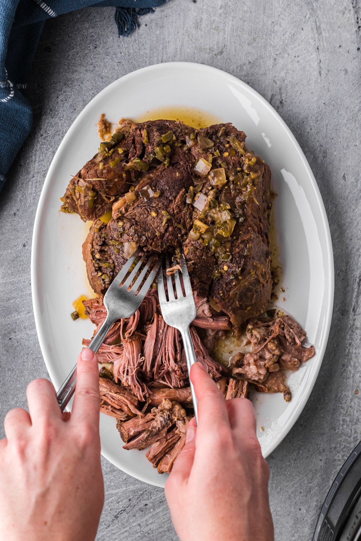 beef roast being shredded