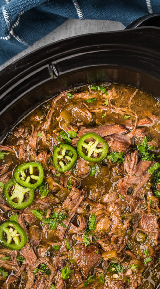 long image of salsa verde beef in a crockpot.