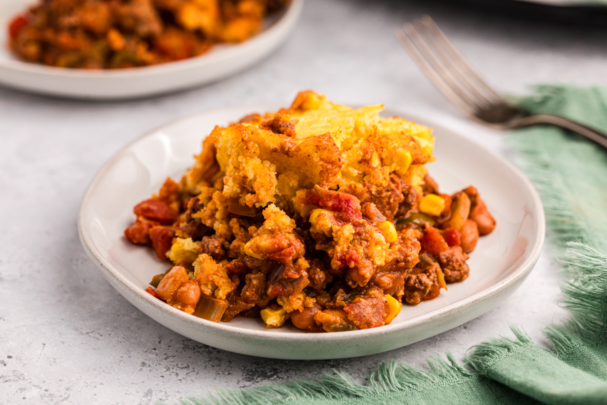 White plate with tamale pie on it.