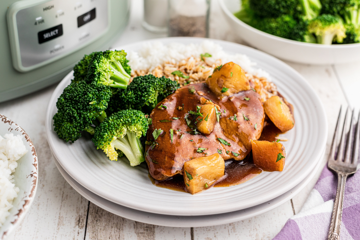 plate of pork chops in teriyaki sauce with pineapple.