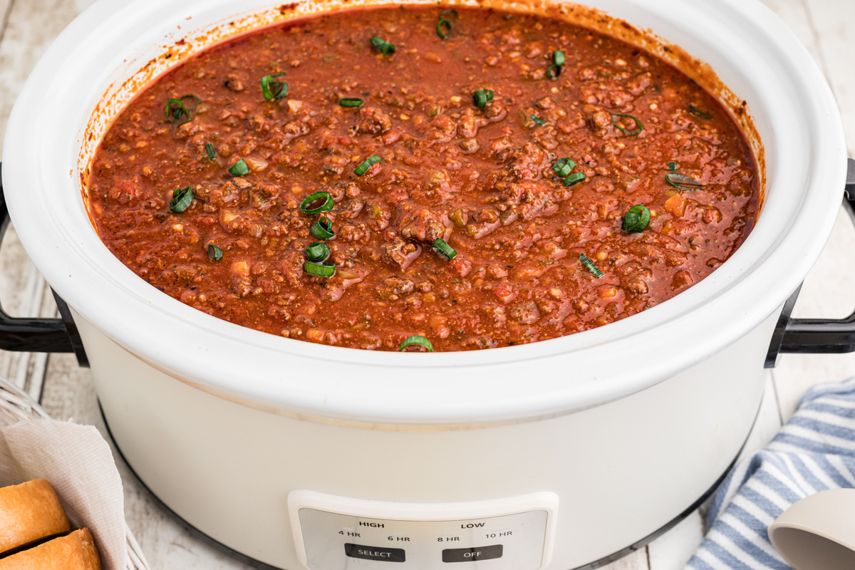 Side view of spaghetti sauce in a crockpot.