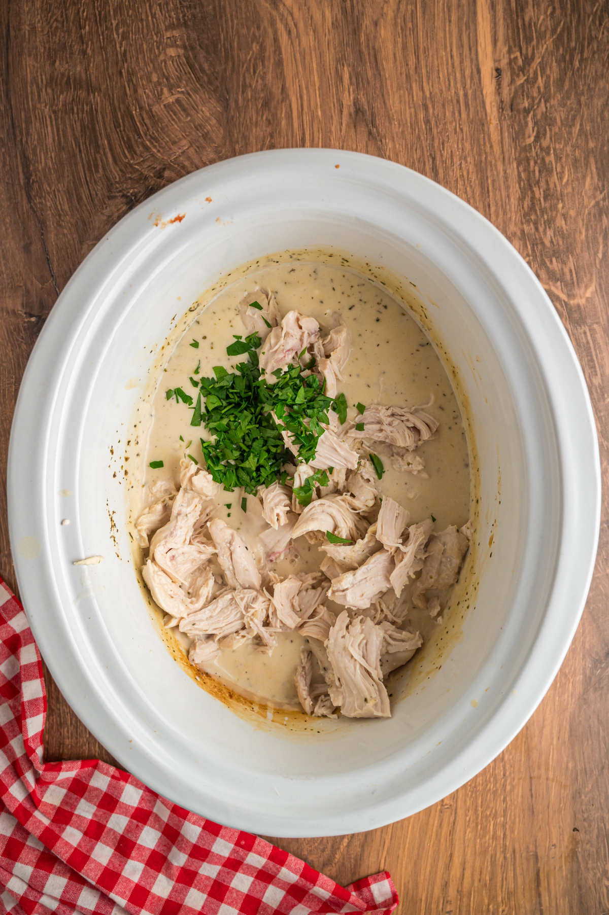 the chicken shredded and added back to the slow cooker.