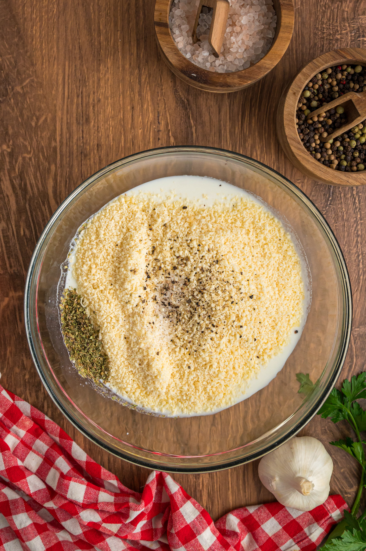 heavy cream, parmesan, and seasonings in a bowl.